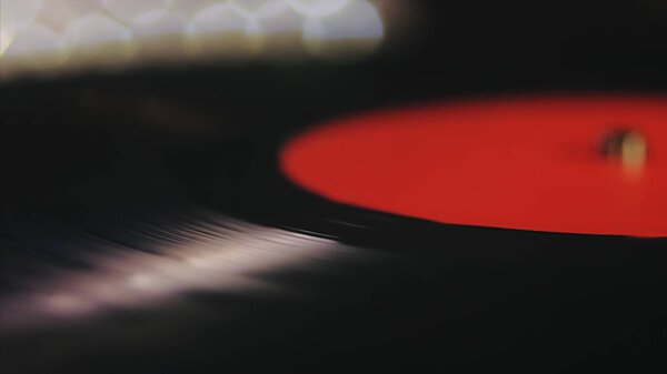 A retro-styled spinning record vinyl player.