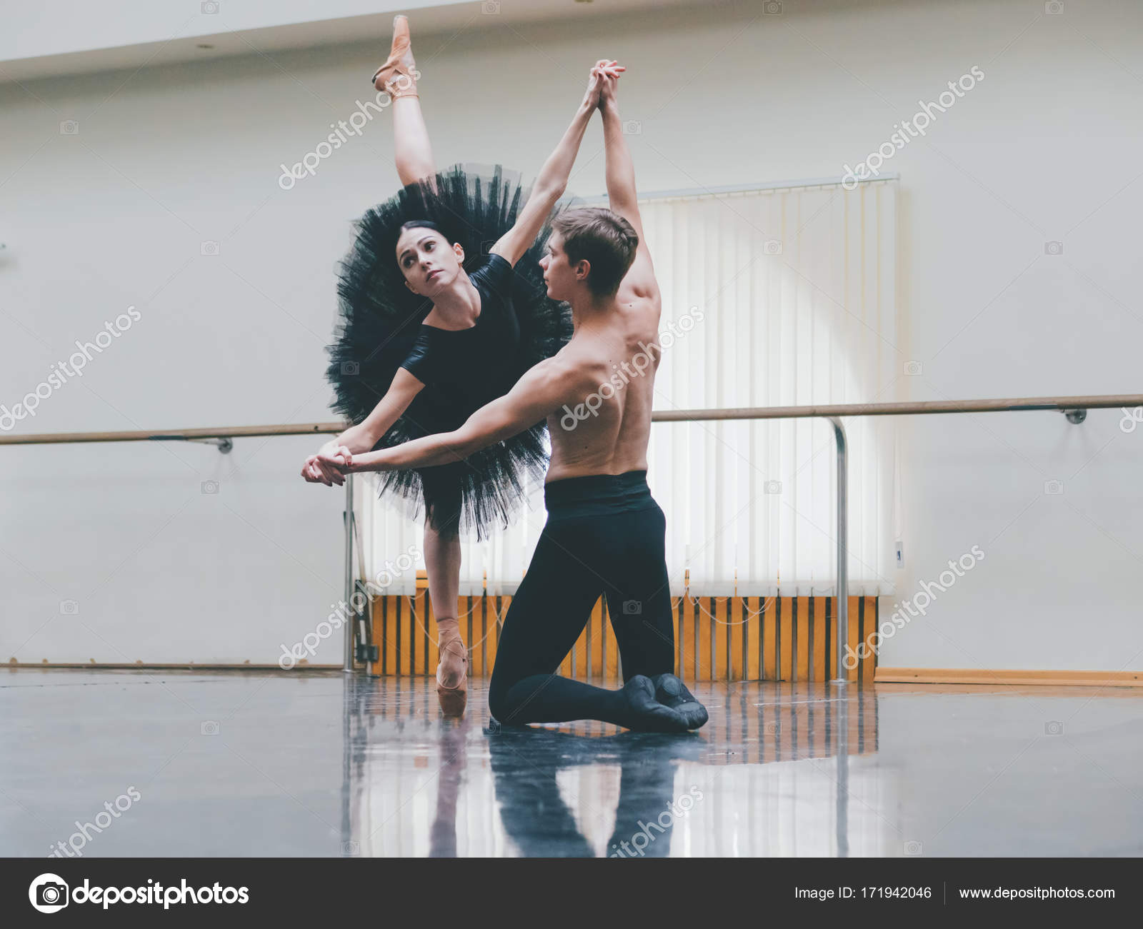 Young man practicing in classical ballet with young beautiful