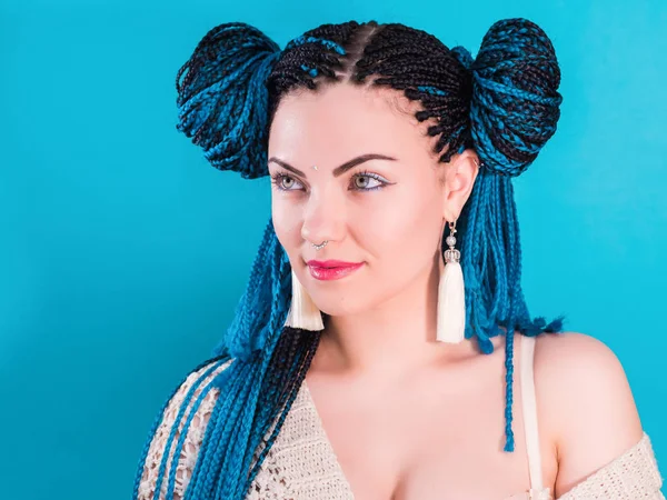 Glamour luxury portrait of sexy woman with african blue braids hairstyle, bindi, nose ring and tassel earrings isolated on colorful background. Girl in fur, bright makeup, hipster, freaky — Stock Photo, Image