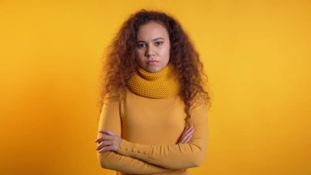 Pretty girl disapproving with no crossing hands sign make negation gesture. Denying, Rejecting, Disagree, Portrait of woman on yellow background. — Stockvideo