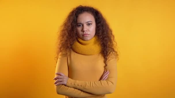 Pretty girl disapproving with no crossing hands sign make negation gesture. Denying, Rejecting, Disagree, Portrait of woman on yellow background. — Stock Video