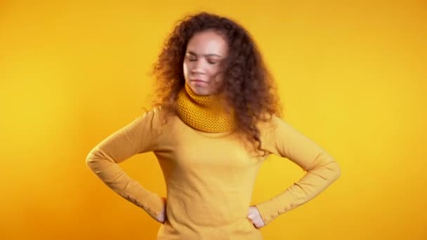 Cute girl disapproving with no crossing hands sign make negation gesture. Denying, Rejecting, Disagree, Portrait of pretty woman on yellow background — Stock Video