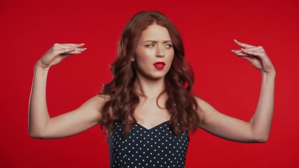 Pretty millenial girl showing with hands and two fingers like quotes gesture, bend fingers isolated over red background. Very funny, irony and sarcasm concept. — 비디오