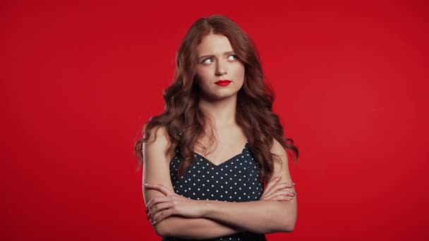 Young upset woman with curly red hair is dissatisfied, unhappy. Studio portrait of girl, she shaking head like gesture of disagreement and disappointment — Stock Video