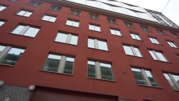 Steadicam shot: modern buildings in old european city. Facades of houses in narrow streets at Scandinavia. Traveling concept. Slow motion. — Stock video