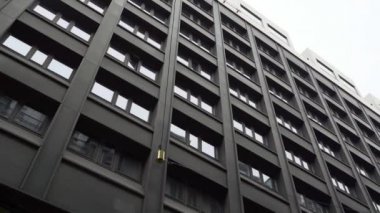 Steadicam shot: modern buildings in old european city. Facades of houses in narrow streets at Scandinavia. Traveling concept. Slow motion.