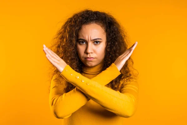No, never, pretty curly woman disliking and rejecting gesture by stop crossing hands sign. Cute girl disapproving sign make negation sign — Stock Photo, Image