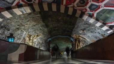 14 February 2020, Stockholm, Sweden. Kings Garden Kungstradgarden Station at subway. Timelapse. Crowd of people walking. Art in underground.