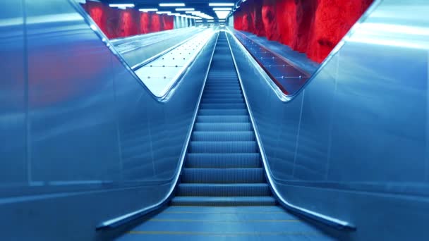 Pedestrian crossing escalator goes endlessly without people. Automatic stairs moving up at Stockholm metro station — Stock Video