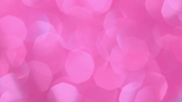 Abstrakter Hintergrund mit leuchtendem rosa Bokeh funkelt. Glitzernde Teilchen. Defokussierte kreisförmige Facula. Natürliche schwimmende organische abstrakte Hintergrund. Weihnachten und ein gutes neues Jahr. — Stockvideo