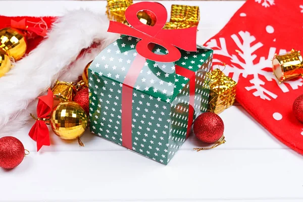 Christmas presents laid on a wooden table background — Stock Photo, Image