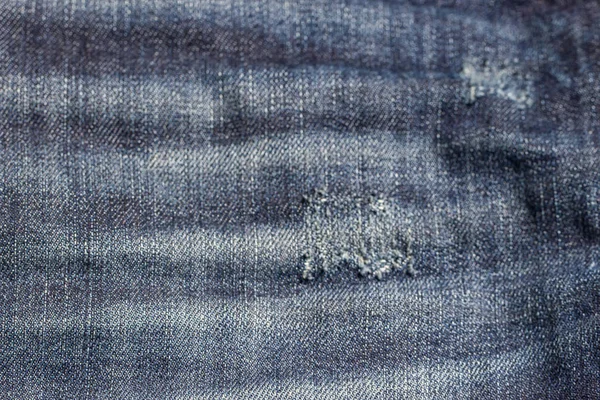 Denim doku yırtık kot pantolon. — Stok fotoğraf