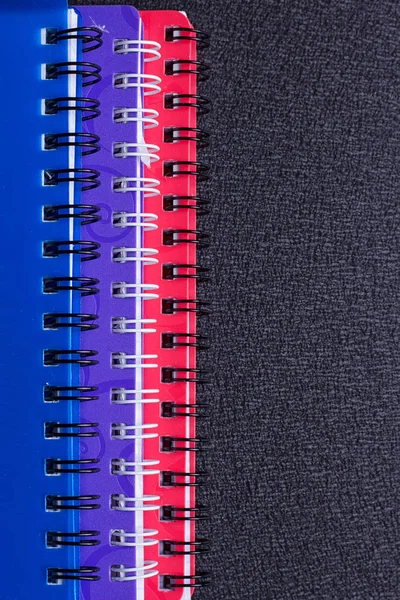 Several multi-colored notebooks on a spiral — Stock Photo, Image