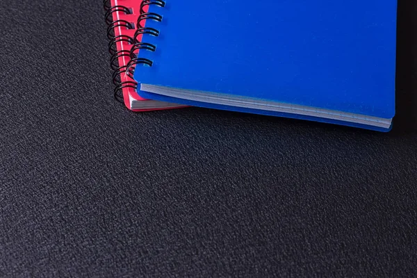 Several multi-colored notebooks on a spiral — Stock Photo, Image