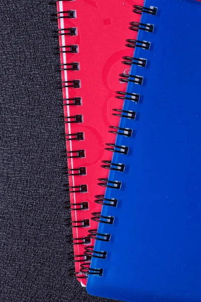 Several multi-colored notebooks on a spiral — Stock Photo, Image