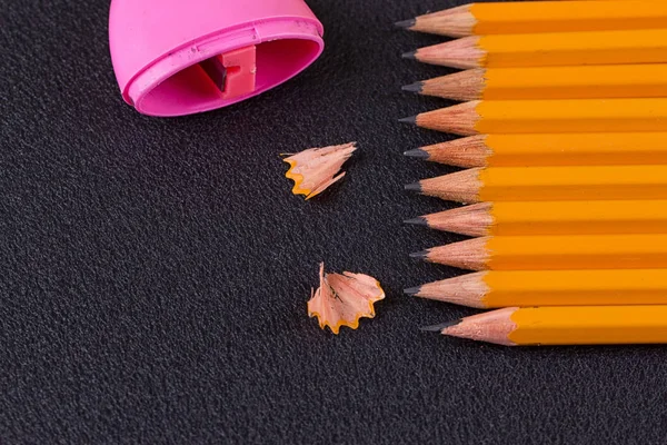 Simple pencils and a pink pencil sharpener