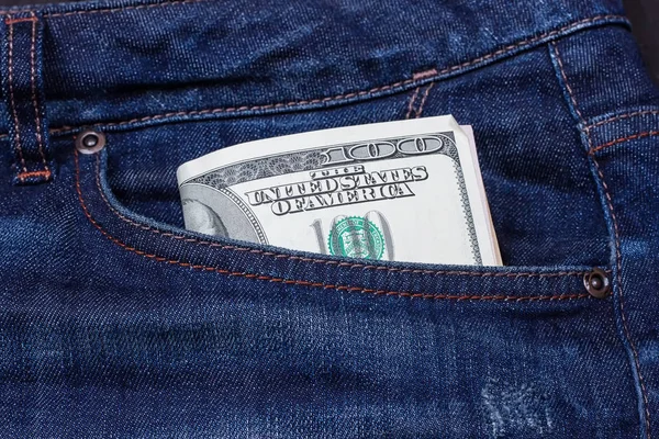 Dollars in a pocket of jeans — Stock Photo, Image