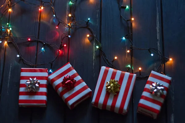 Gift box and garland lights — Stock Photo, Image