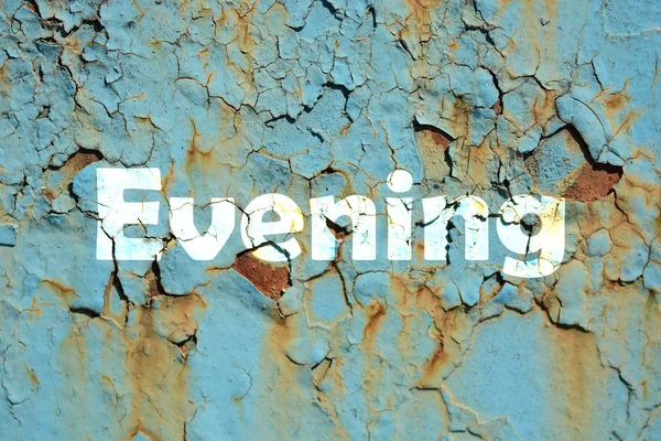 Evening word print on the rusty corrugated metal wall texture background — Stock Photo, Image