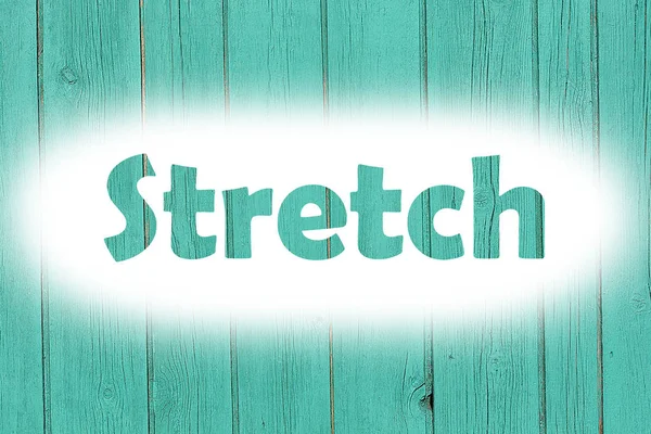 Stretch word print on the grunge wooden plate — Stock Photo, Image