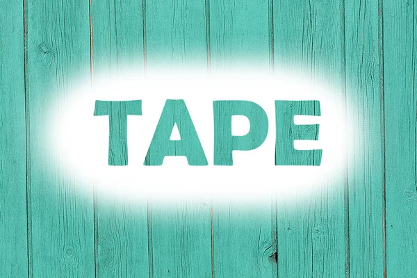 Tape word afdrukken op de houten plaat van grunge — Stockfoto