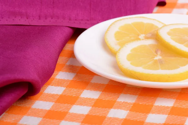 Lemon sliced lies on a plate shaped — Stock Photo, Image