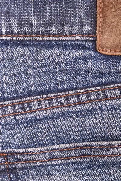 denim jeans background with seam of jeans fashion design. Old grunge vintage denim jean