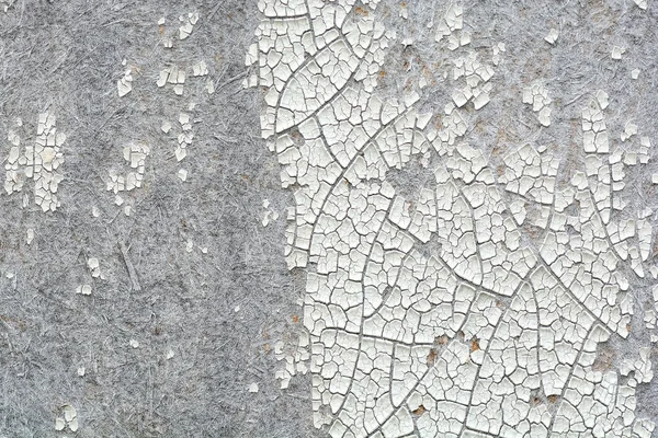 Una textura de pintura agrietada en una pared de hormigón —  Fotos de Stock