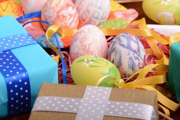 Handcrafted easter eggs close up, gift boxes , ribbons and decoration — Stock Photo, Image