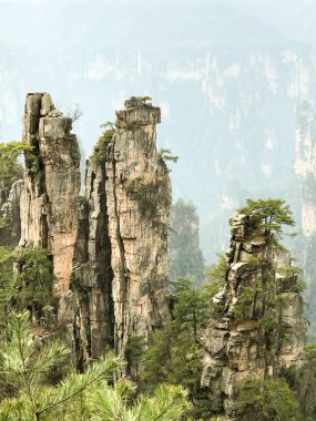 Amazing view of natural quartz sandstone pillars of the Tianzi Mountains (Avatar Mountains) in the Zhangjiajie National Forest Park, Hunan Province, China. clipart