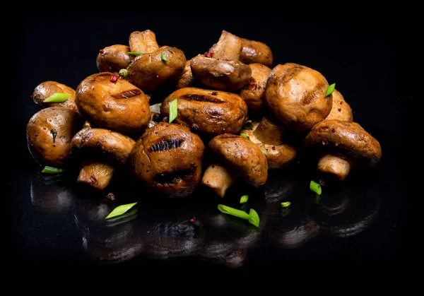 Champignon mushrooms cooked at the stake