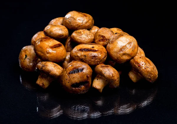 Champignon mushrooms cooked at the stake