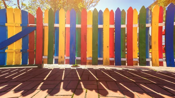 Multicolored fence in kindergarten — Stock Photo, Image