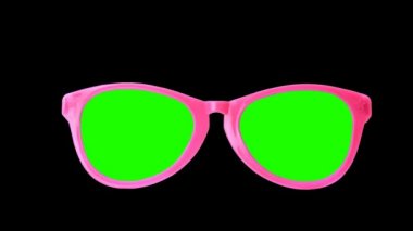hareket bir güneş gözlüğü siyah bir zemin üzerine özel içerik için yeşil bir ekran ile.