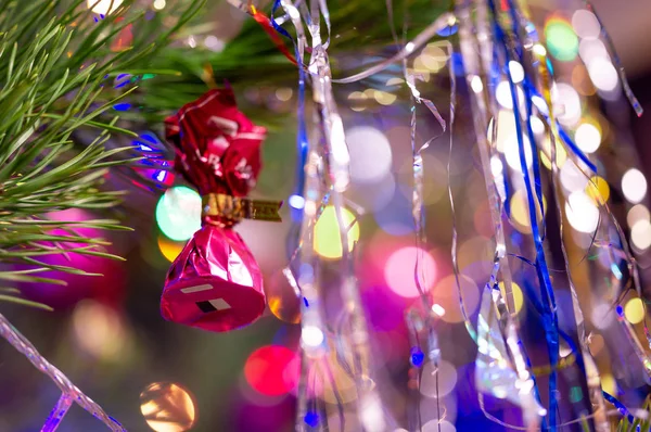 Candy is hanging on a Christmas tree. — Stock Photo, Image