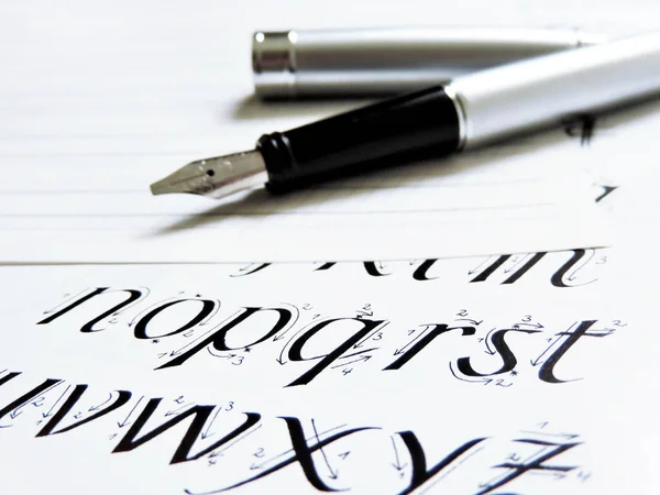 Calligraphy scene with elegant fountain pen — Stock Photo, Image