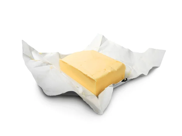 Kousek čerstvého másla v papíru, — Stock fotografie