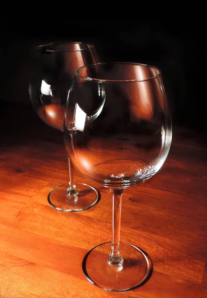 Wine glasses on a wooden table — Stock Photo, Image