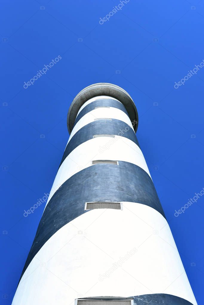 Black and white striped lighthouse or beacon