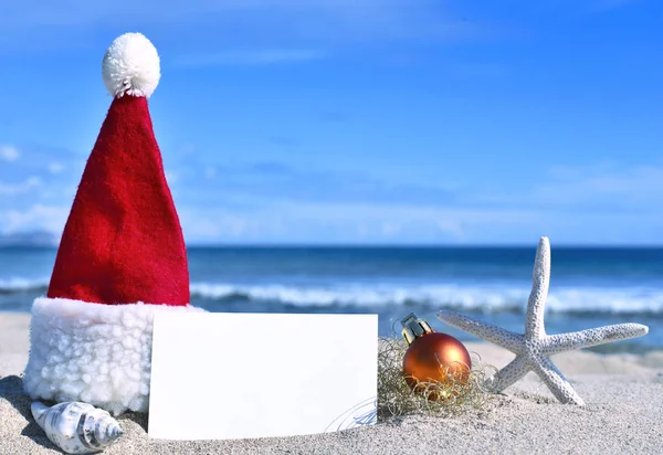 Christmas greeting card on the beach — Stock Photo, Image