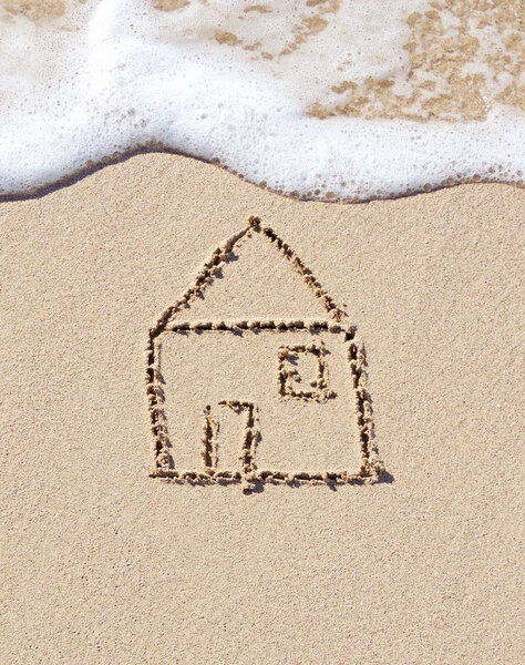 Drawing of a house in the sand