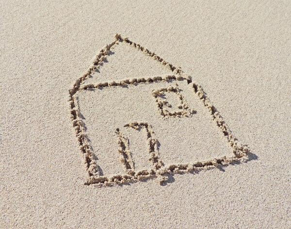 Drawing of a house in the sand