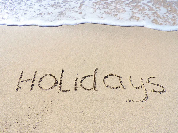 Holiday drawing in the sand — Stock Photo, Image