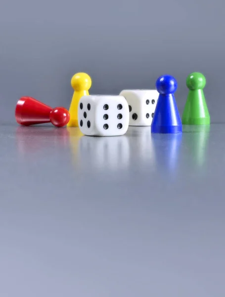 Playing pieces and dice — Stock Photo, Image