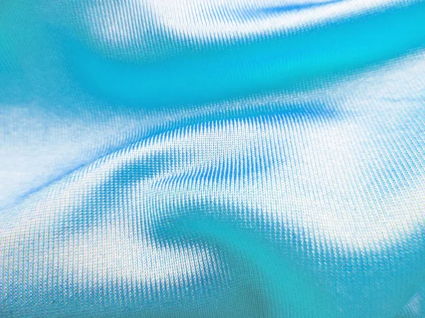 물결 모양의 파란색 새틴 옷감 — 스톡 사진