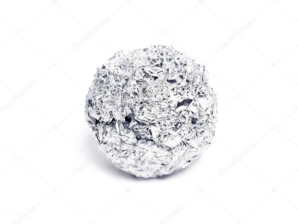 Tinfoil ball, isolated on white background. Isolated object of aluminum foil or silver paper.