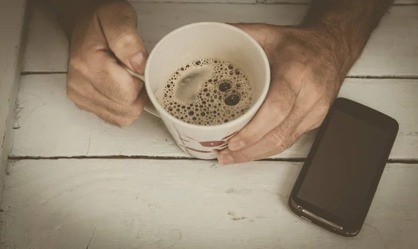 Holding cup of coffe — Stock Photo, Image