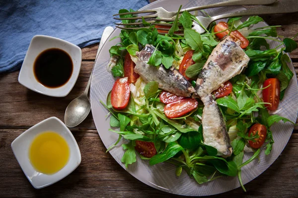 Salad and sardines — Stock Photo, Image