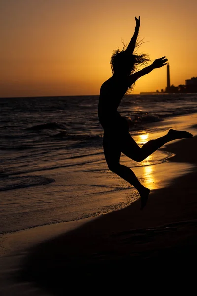 Woman on beach sunset — Stock Photo, Image