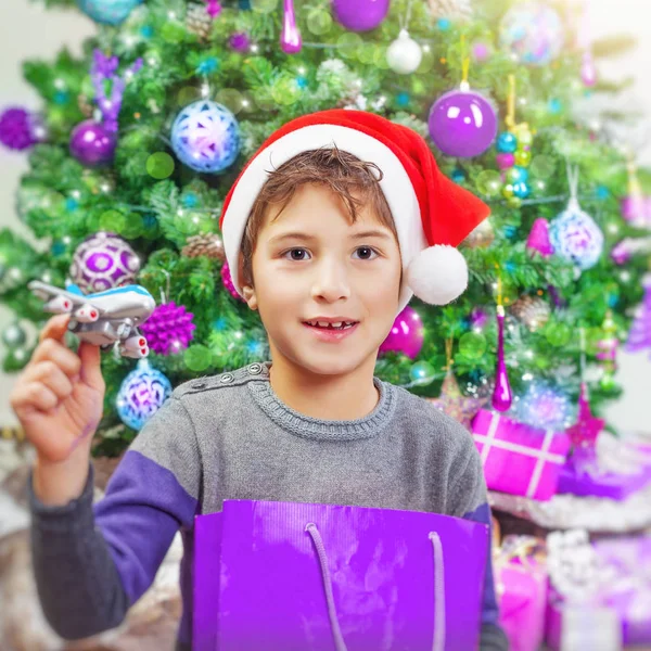 Happy boy near Christmas tree — Stock Photo, Image